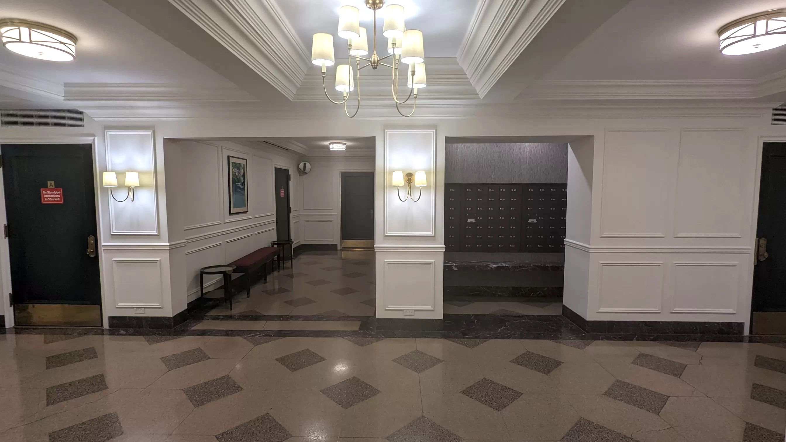 Interior foyer with chandelier and modern flooring
